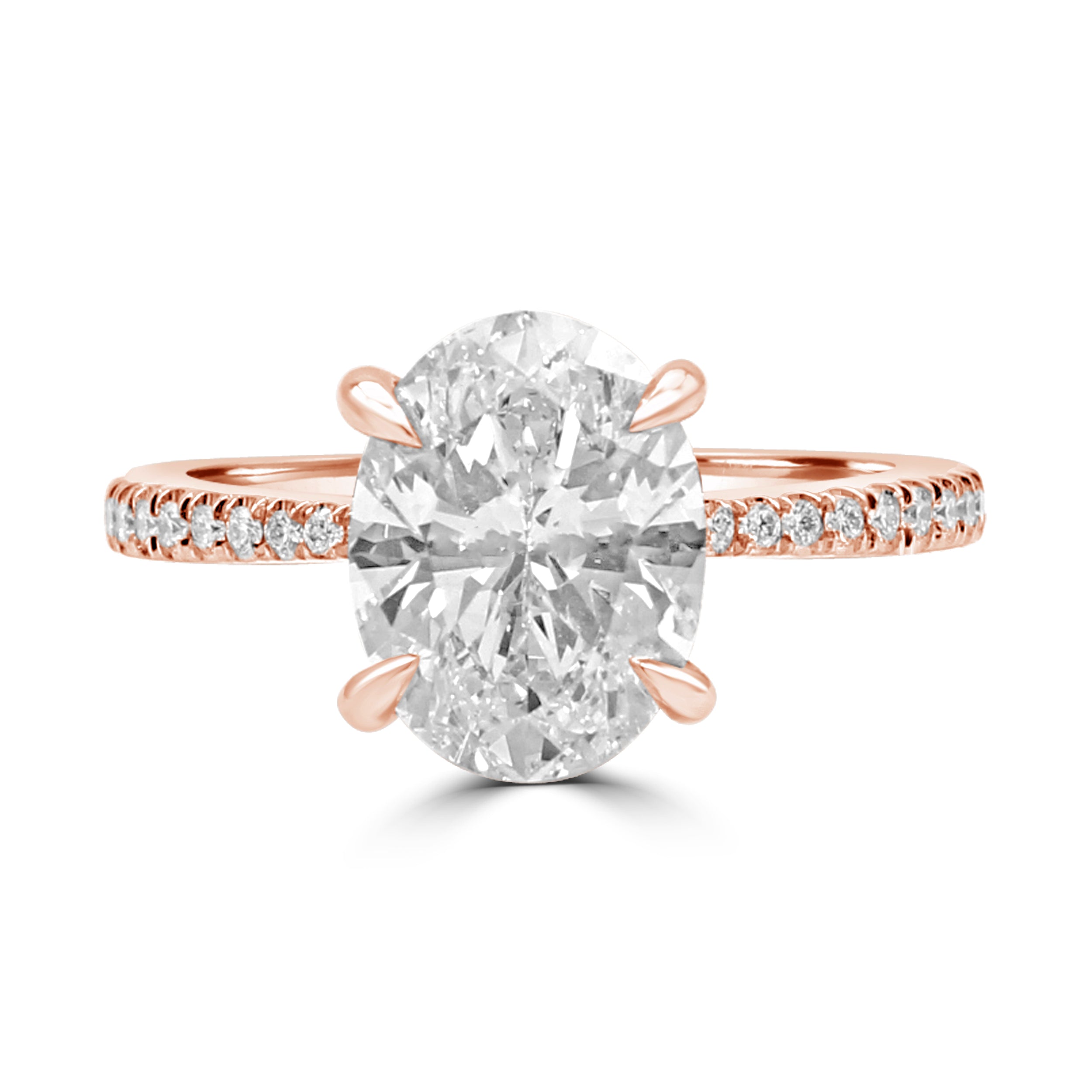 Tapered Oval diamond engagement ring with pave diamonds on the band. Rose gold.