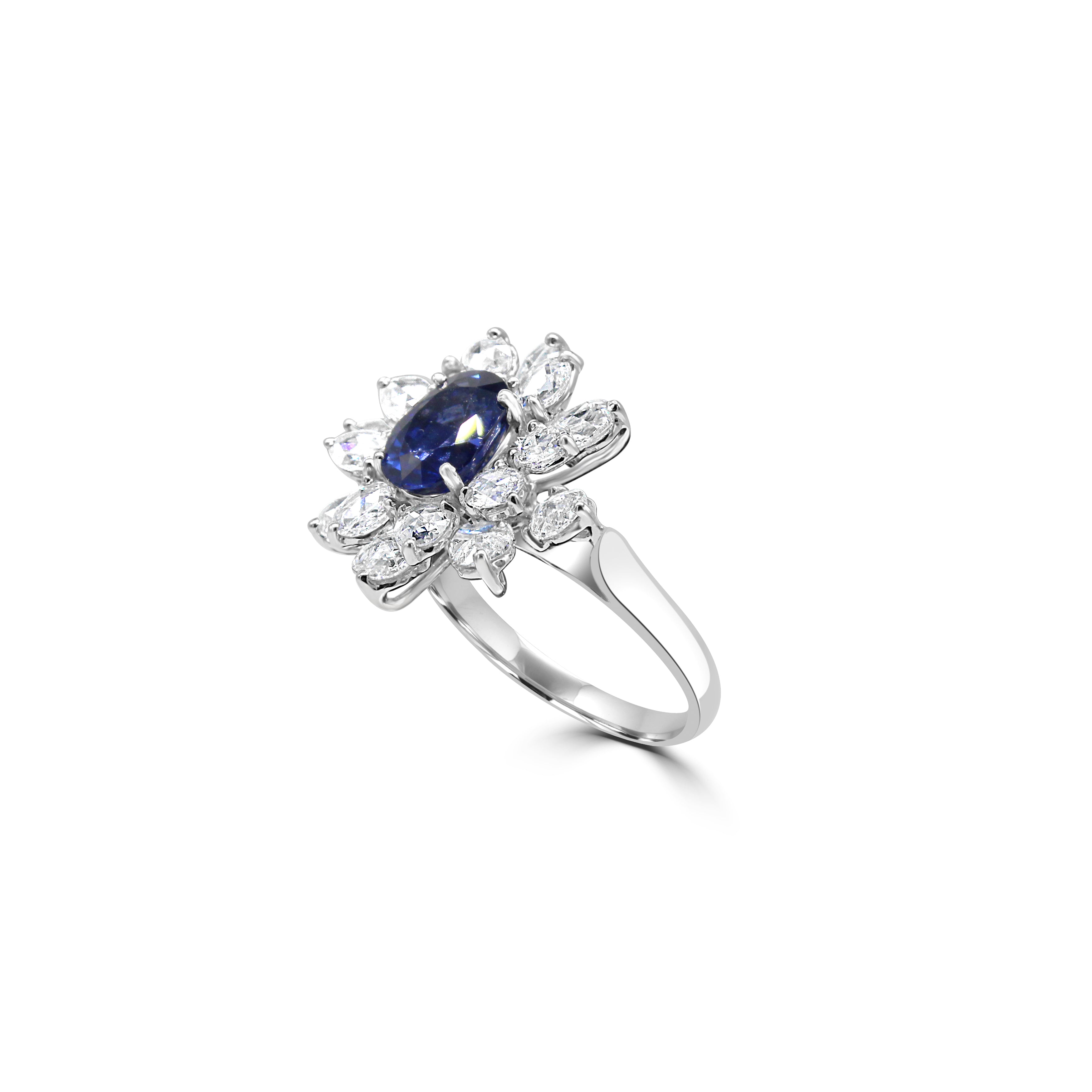 blue sapphire ring, surrounded by floral like petals made of Rose cut diamonds