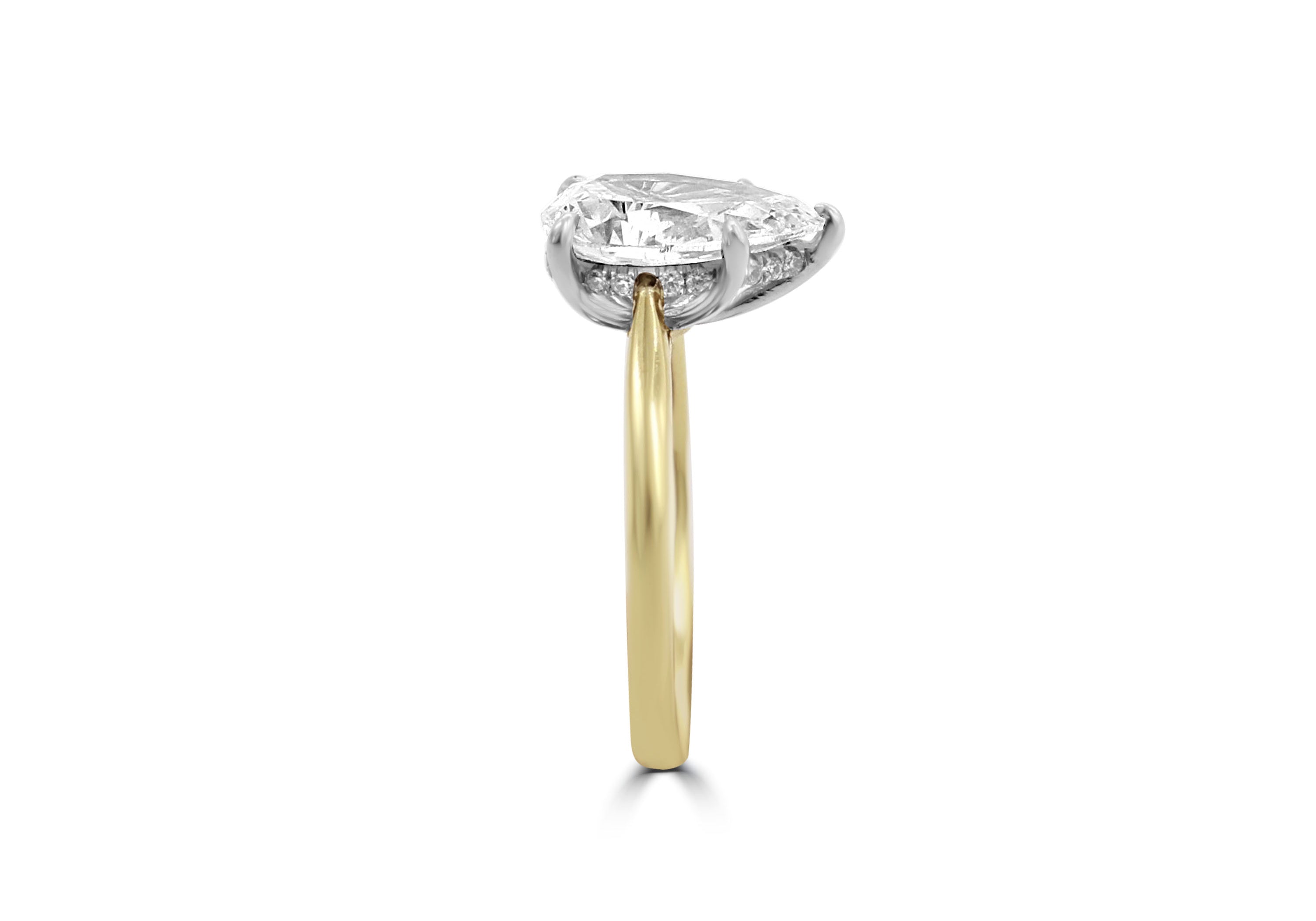 Pear Shape ring with hidden band of diamonds below the stone