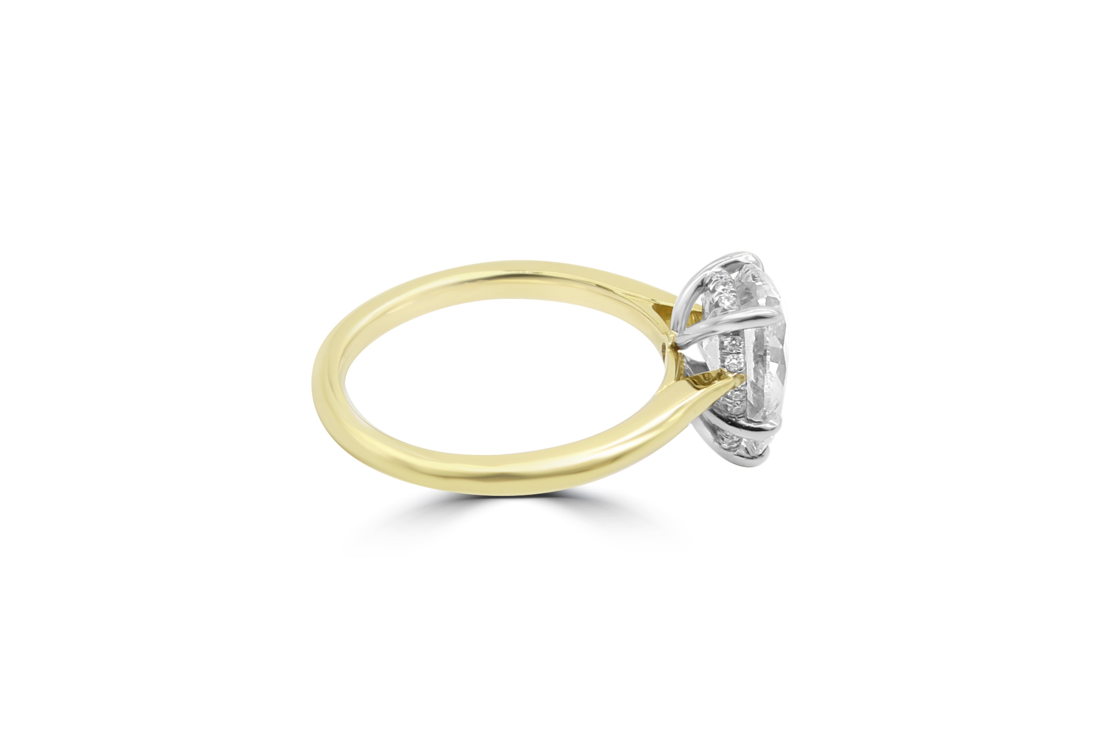 Pear Shape ring with hidden band of diamonds below the stone