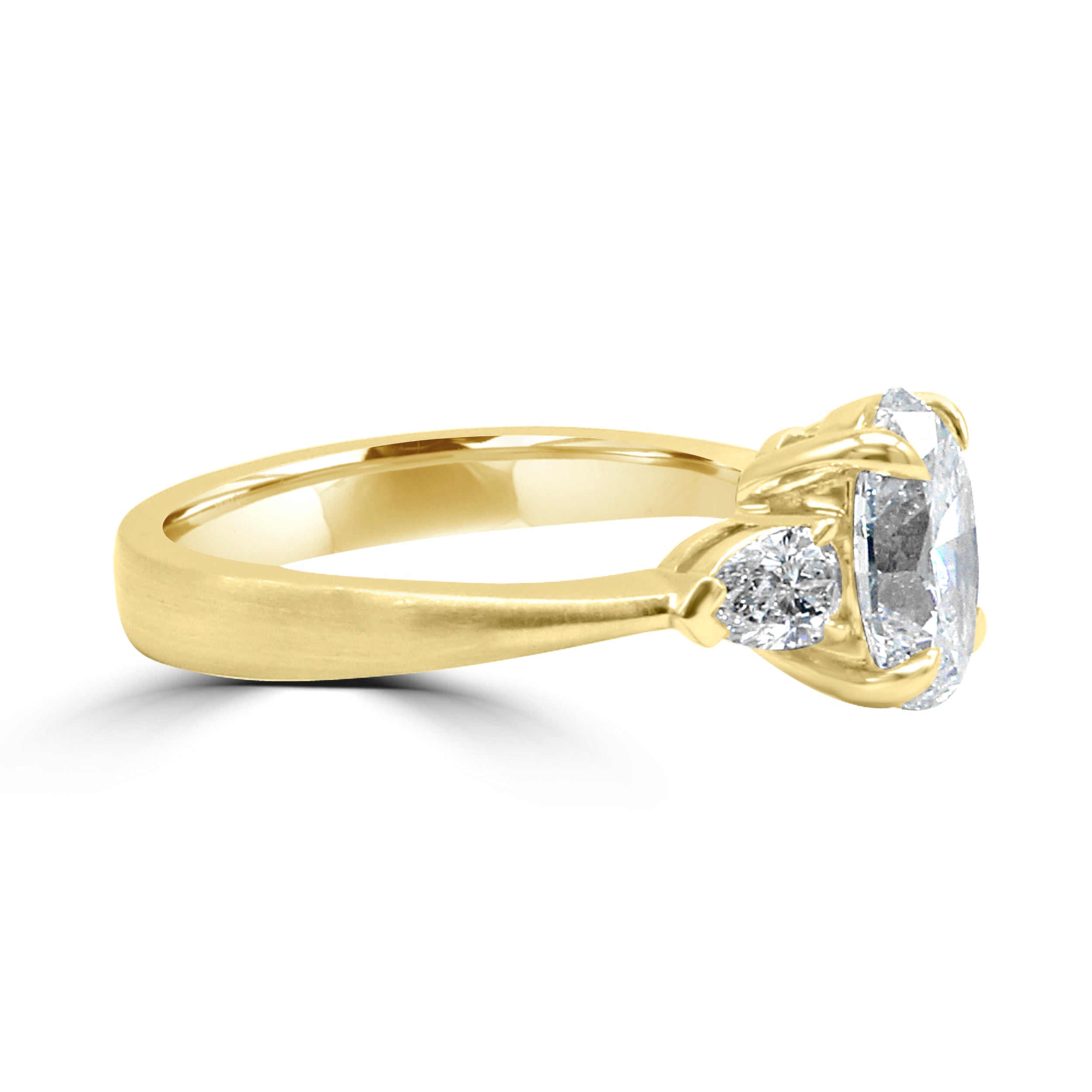 oval diamond with two pear side stone diamond ring