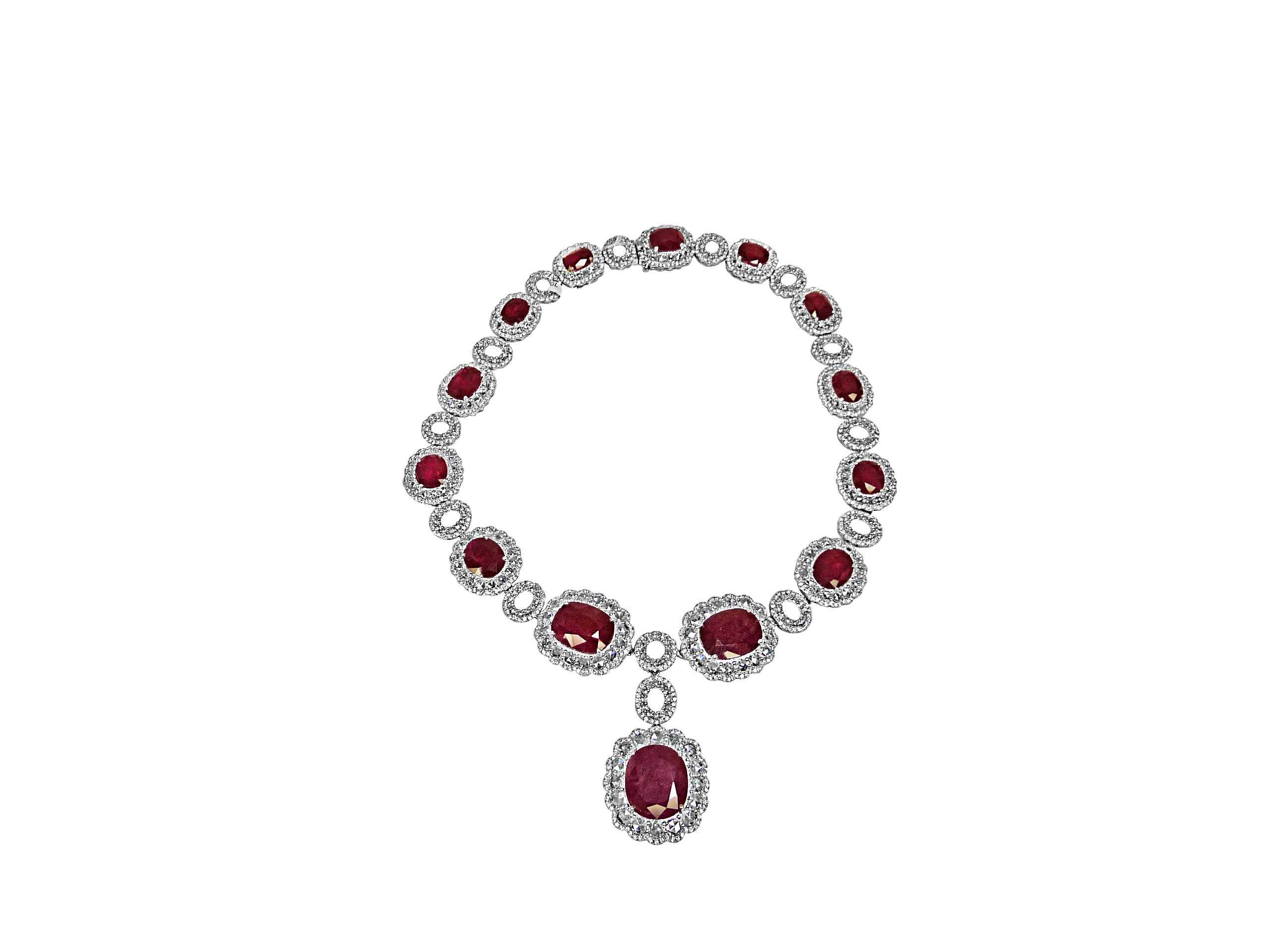 Natural Ruby center stones surrounded by Rose-cut diamonds.