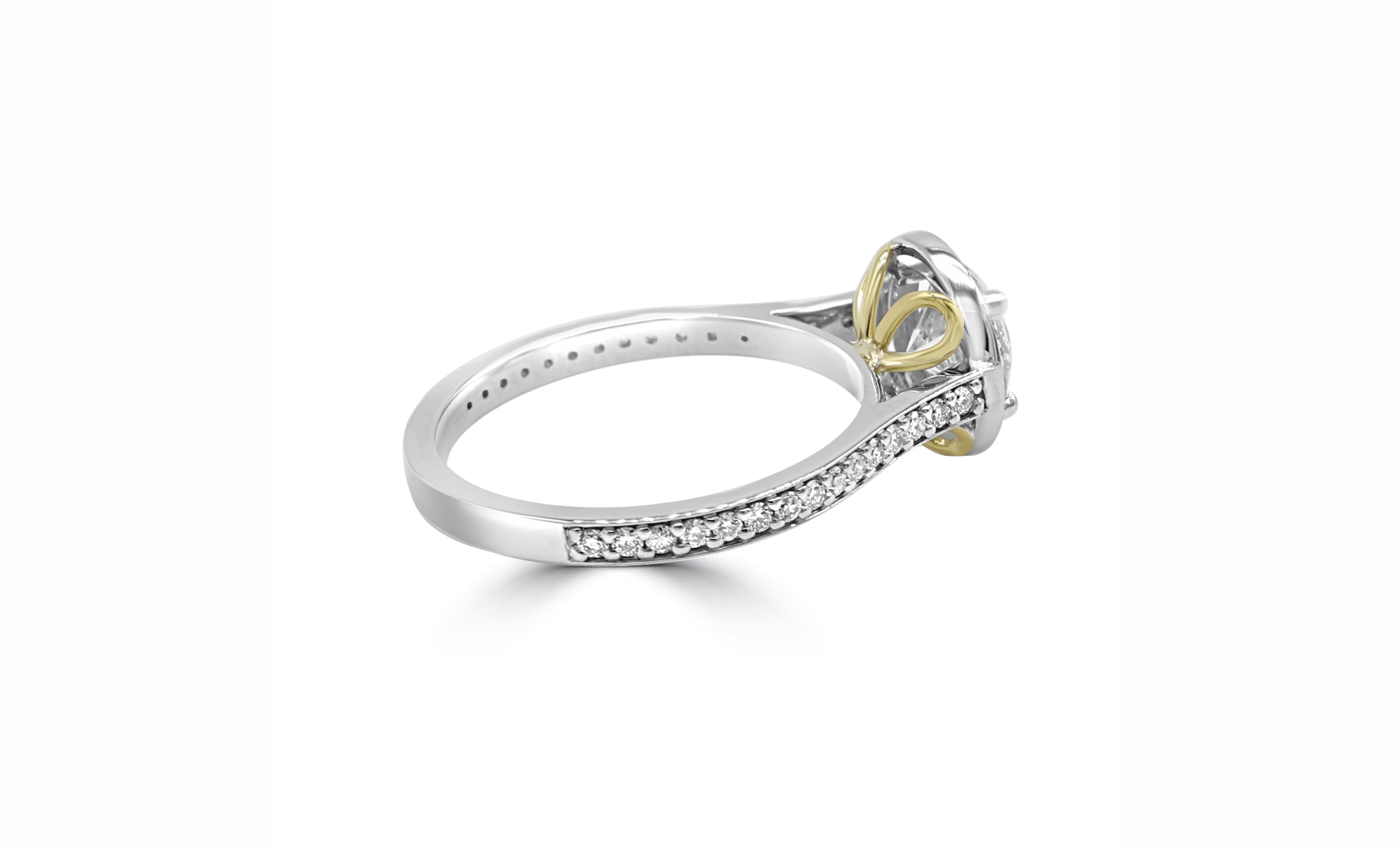 ring with a 3 ct diamond in the center, surrounded by a halo and pave diamonds, and has a unique hidden design underneath