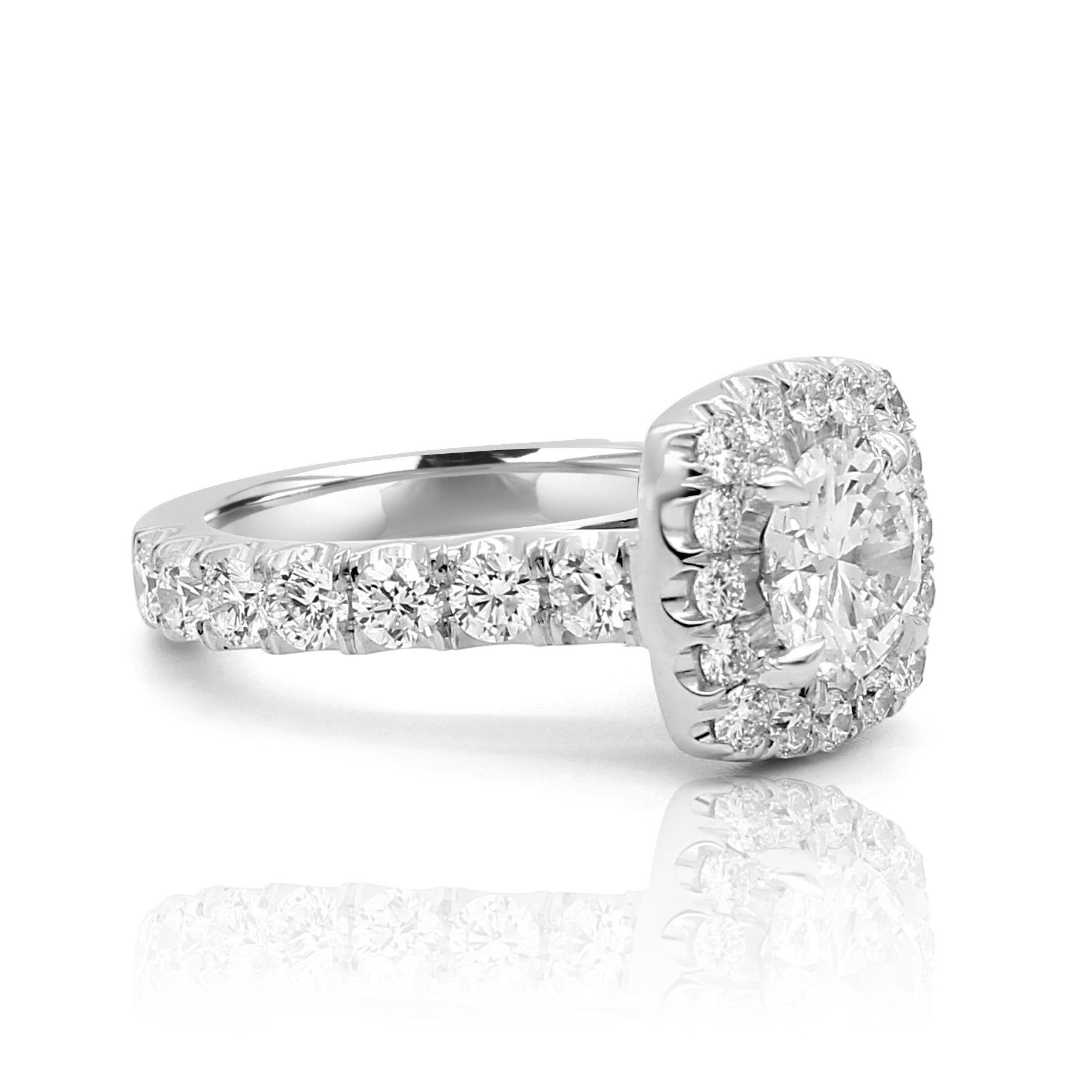 round diamond ring with a wide shank and large halo diamonds