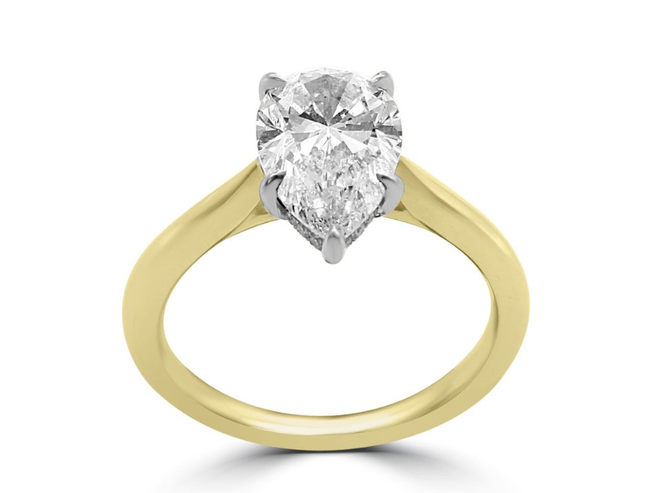 Pear Shape ring with hidden band of diamonds below the stone