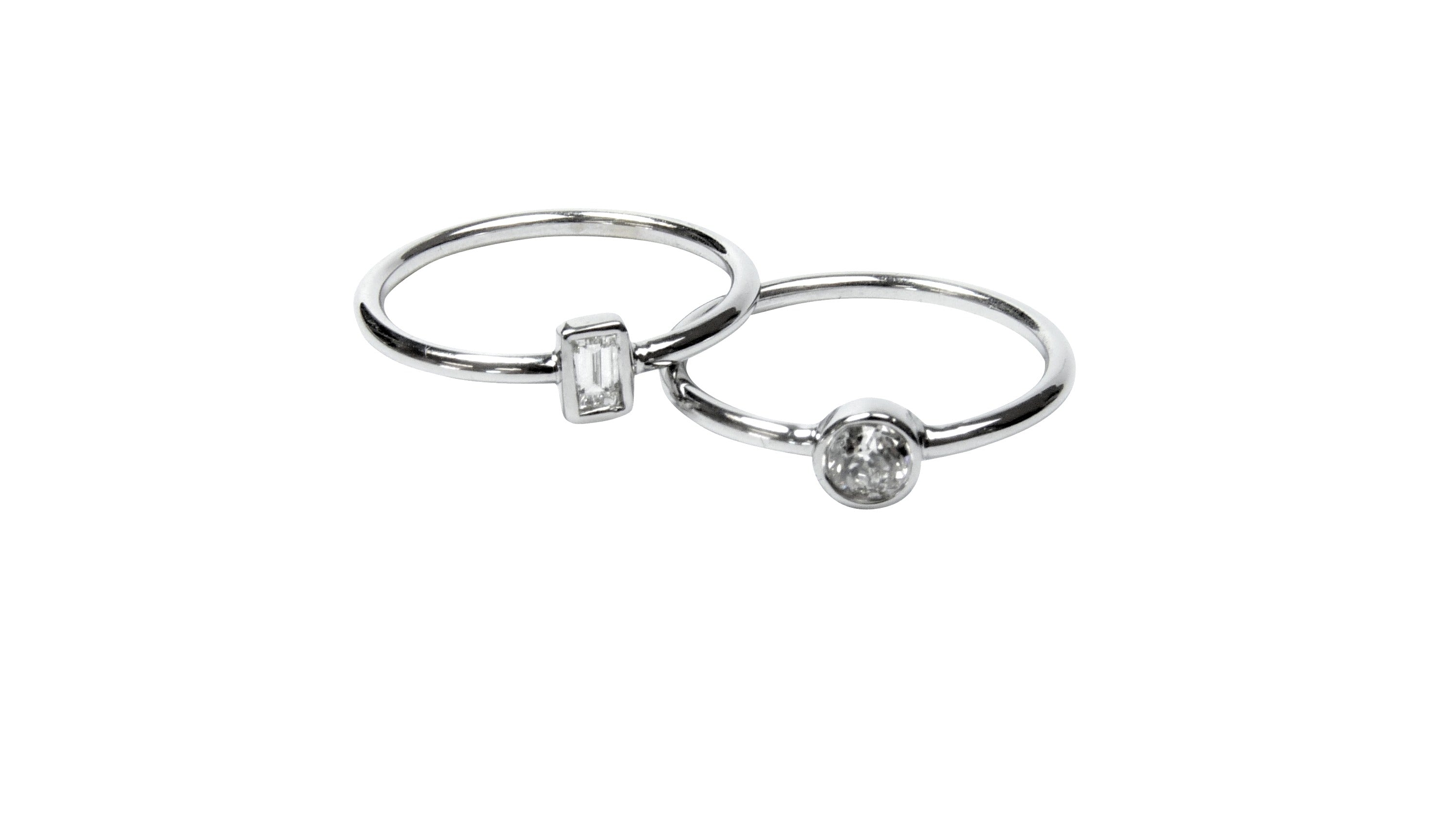 Emerald and Round cut diamond rings