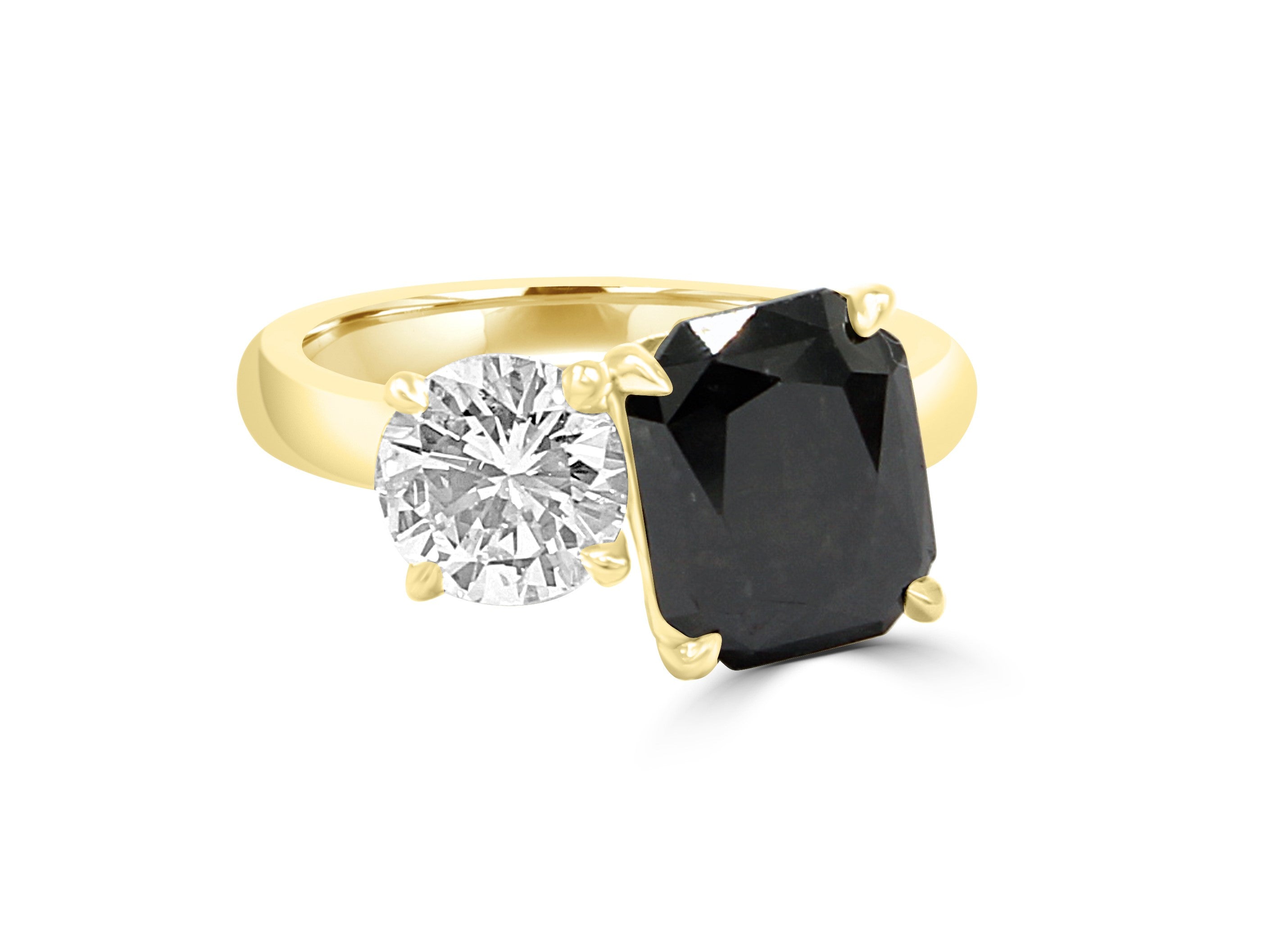 Natural Black Radiant cut Diamond sided next to a round white diamond