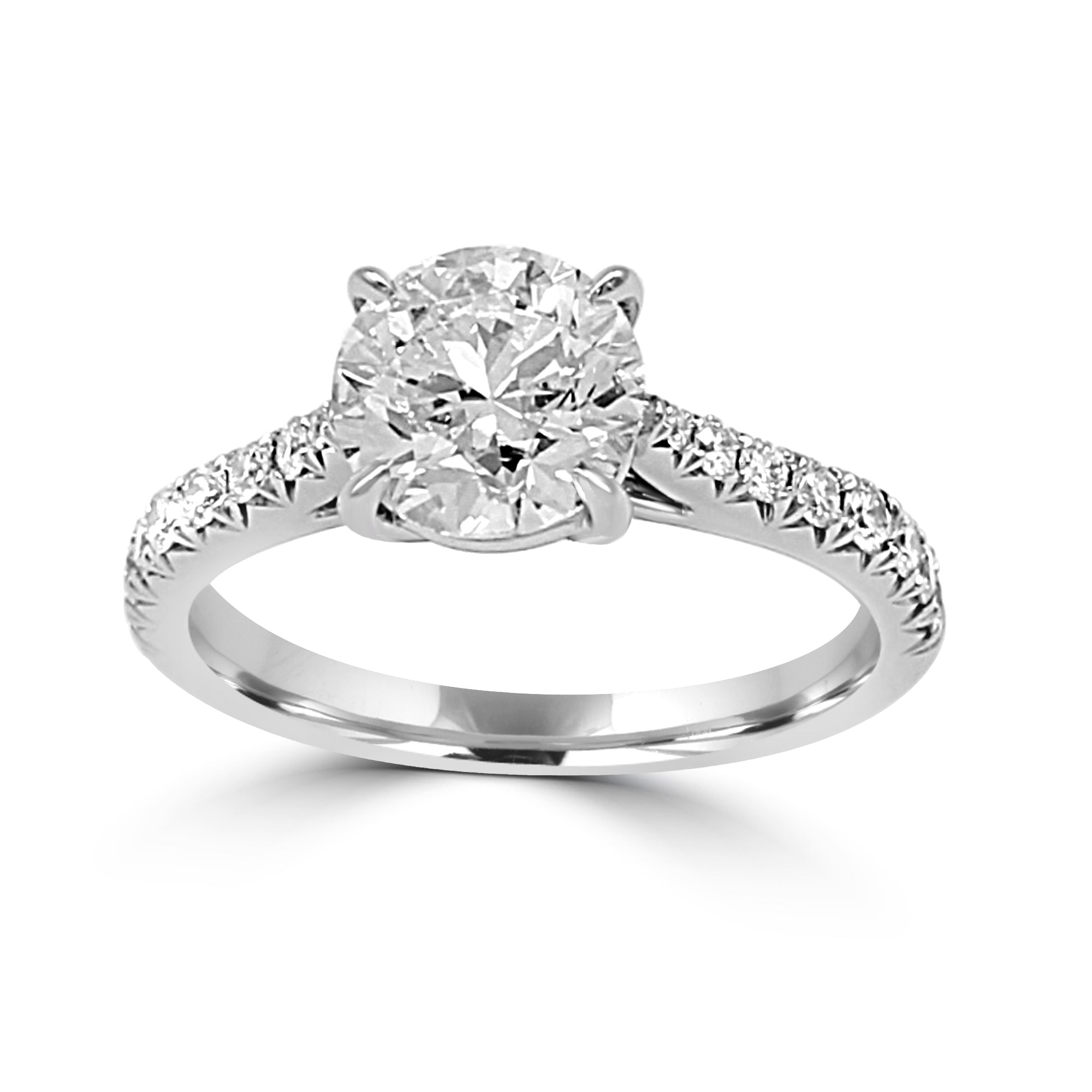 Low-profile ring with French-cut side stones and a center diamond.