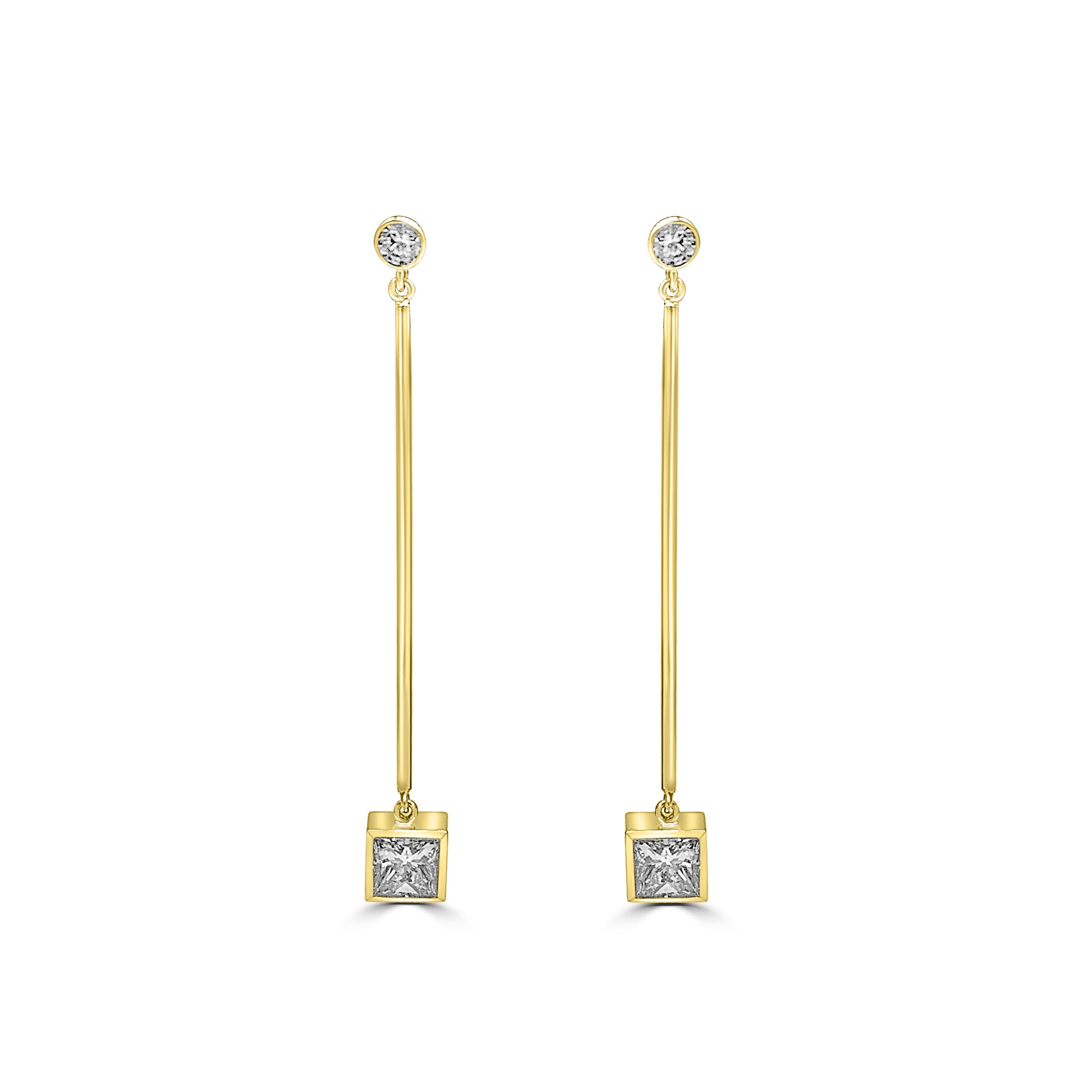 princess cut diamond earrings hanging on a long gold