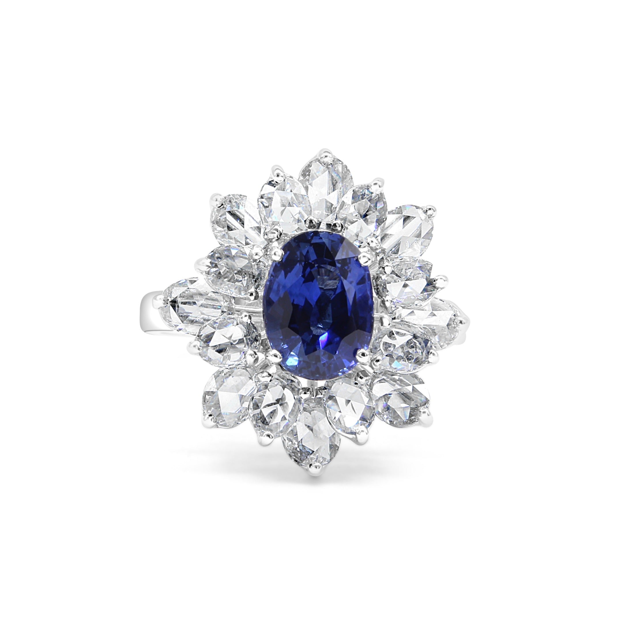 blue sapphire ring, surrounded by floral like petals made of Rose cut diamonds