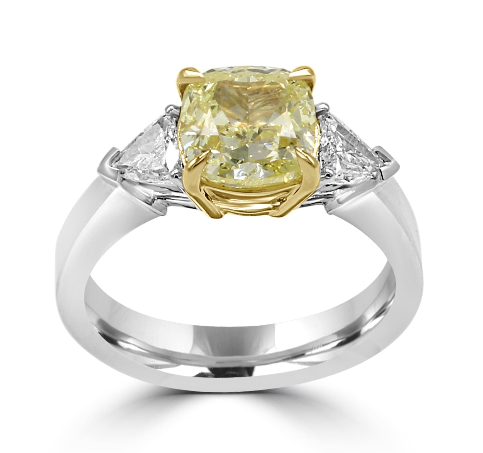 Fancy Yellow Cushion cut diamond in a beautiful two tone ring