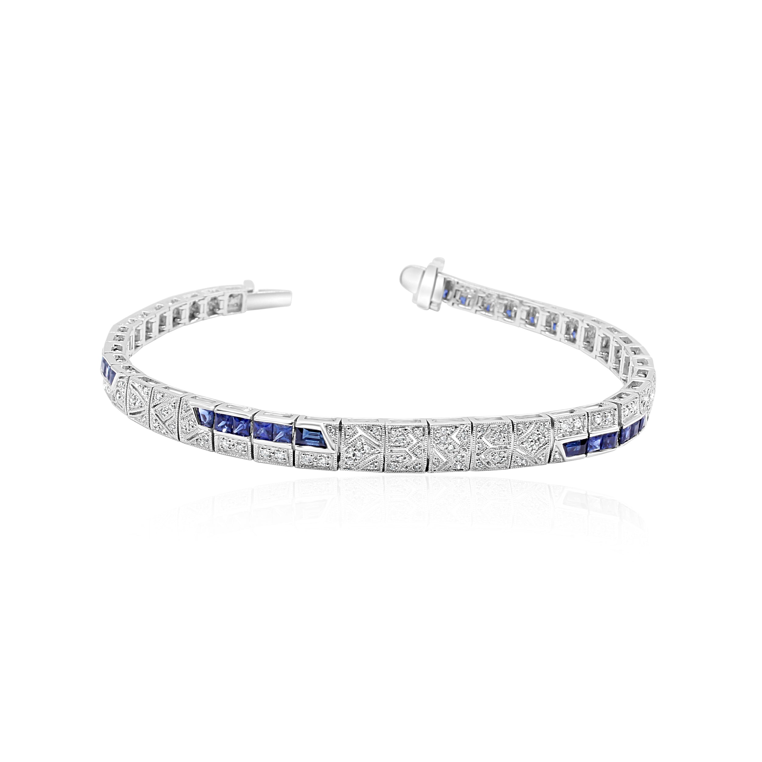 Antique platinum bracelet with intricately woven diamonds and sapphires.