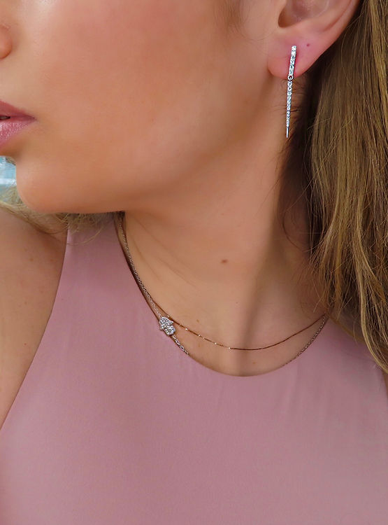 diamond hanging earrings on model