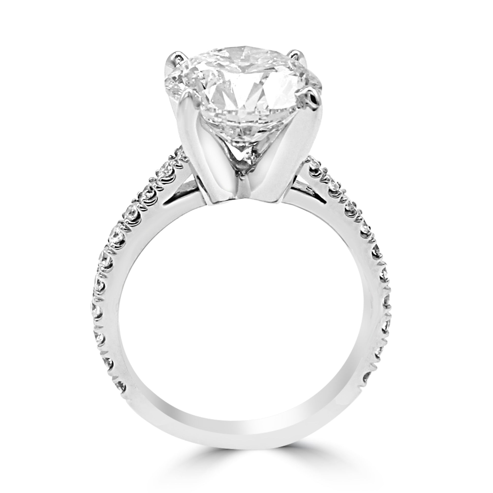 A perfectly cut round diamond in a high, basketless four-prong setting.