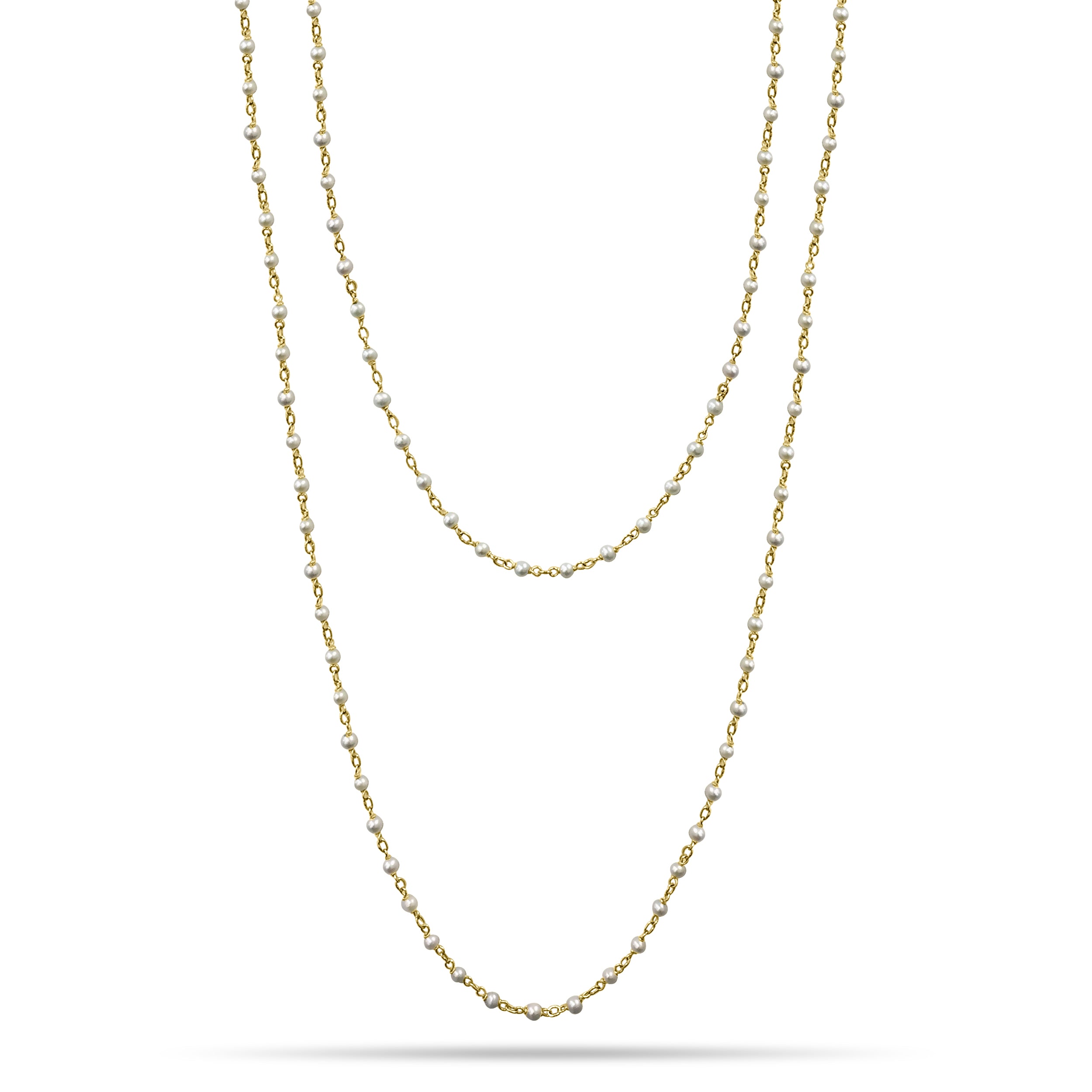 Pearl and Yellow Gold long hanging necklace.