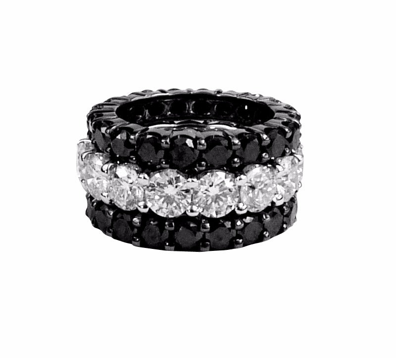 3 diamond eternity bands stacked. Black, white, Black.
