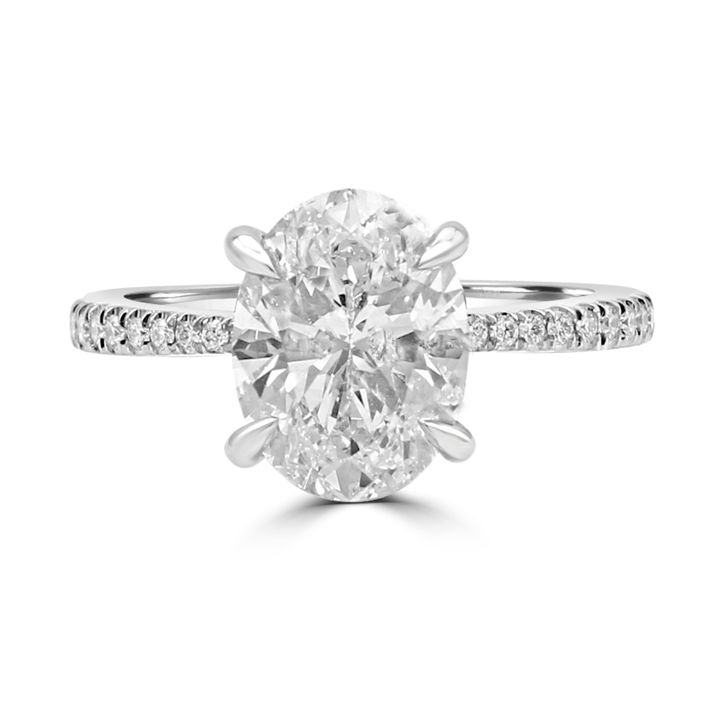 Tapered Oval diamond engagement ring with pave diamonds on the band. Top view