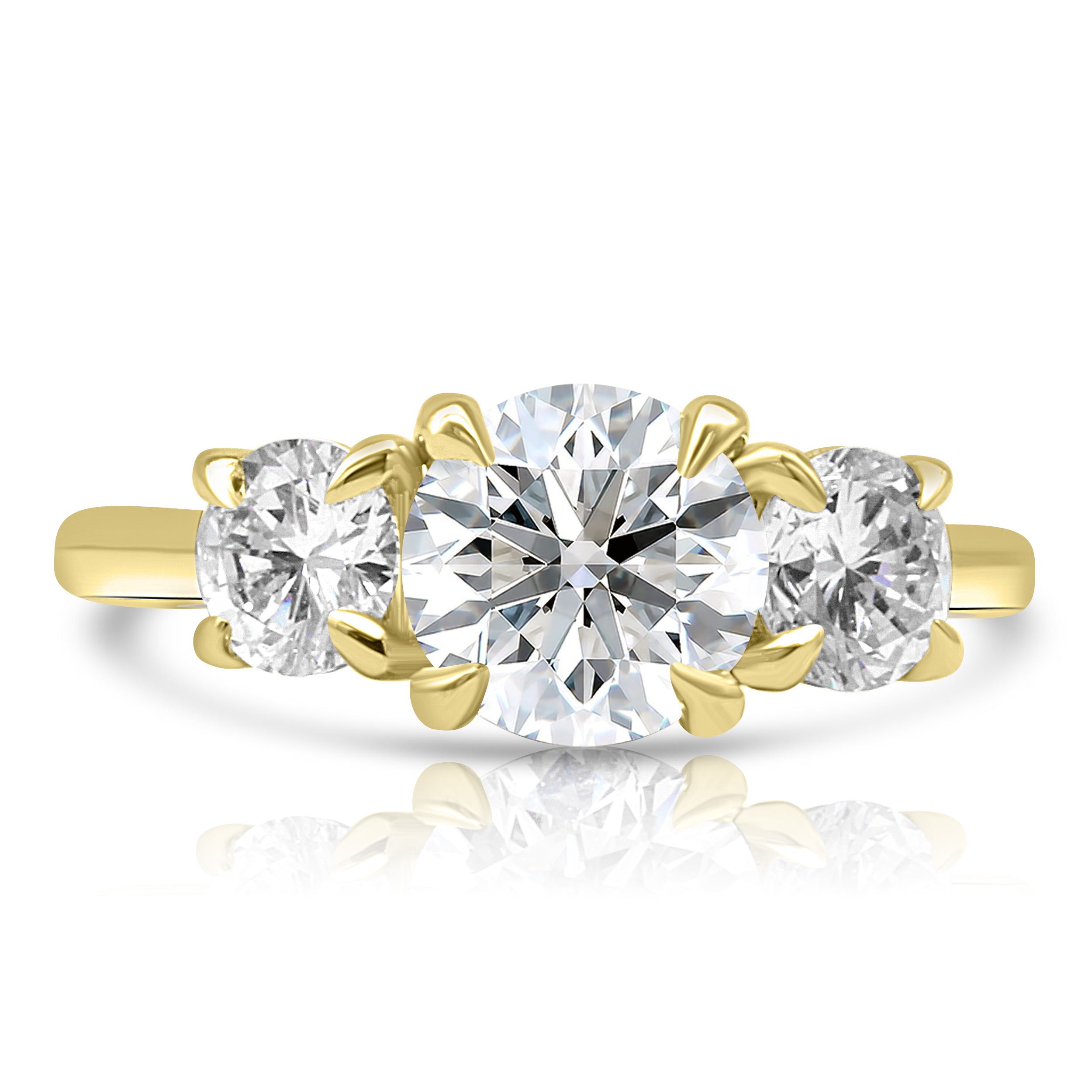 Engagement ring with 3 stone ring All held by four gold prongs each. Gold band.