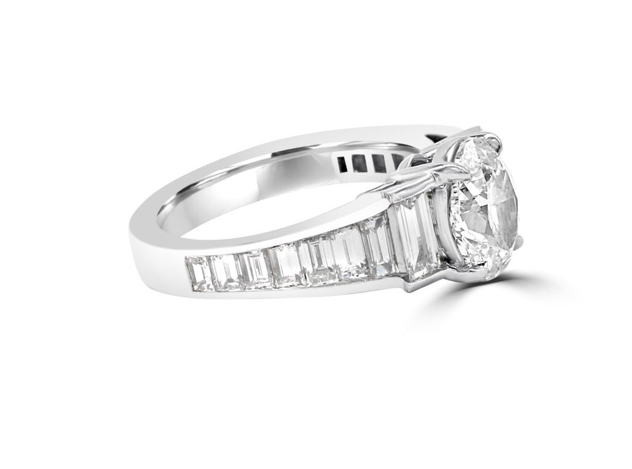 Baguette diamononds set in steps with center Oval diamond