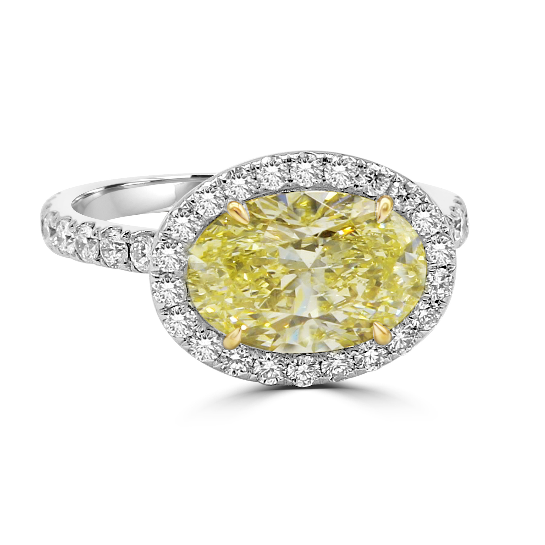 Yellow Oval diamond centerpiece with pave halo and shank