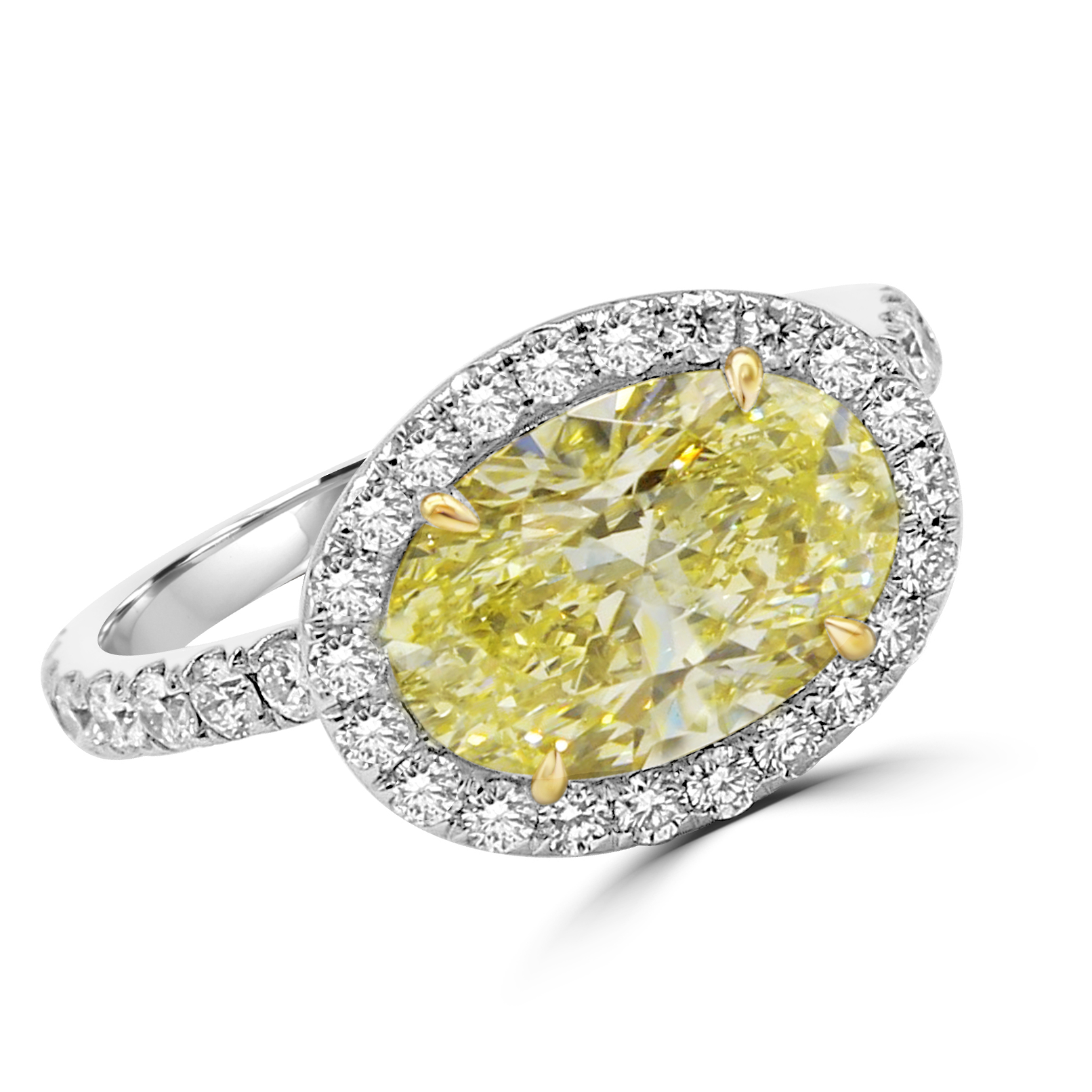 Yellow Oval diamond centerpiece with pave halo and shank