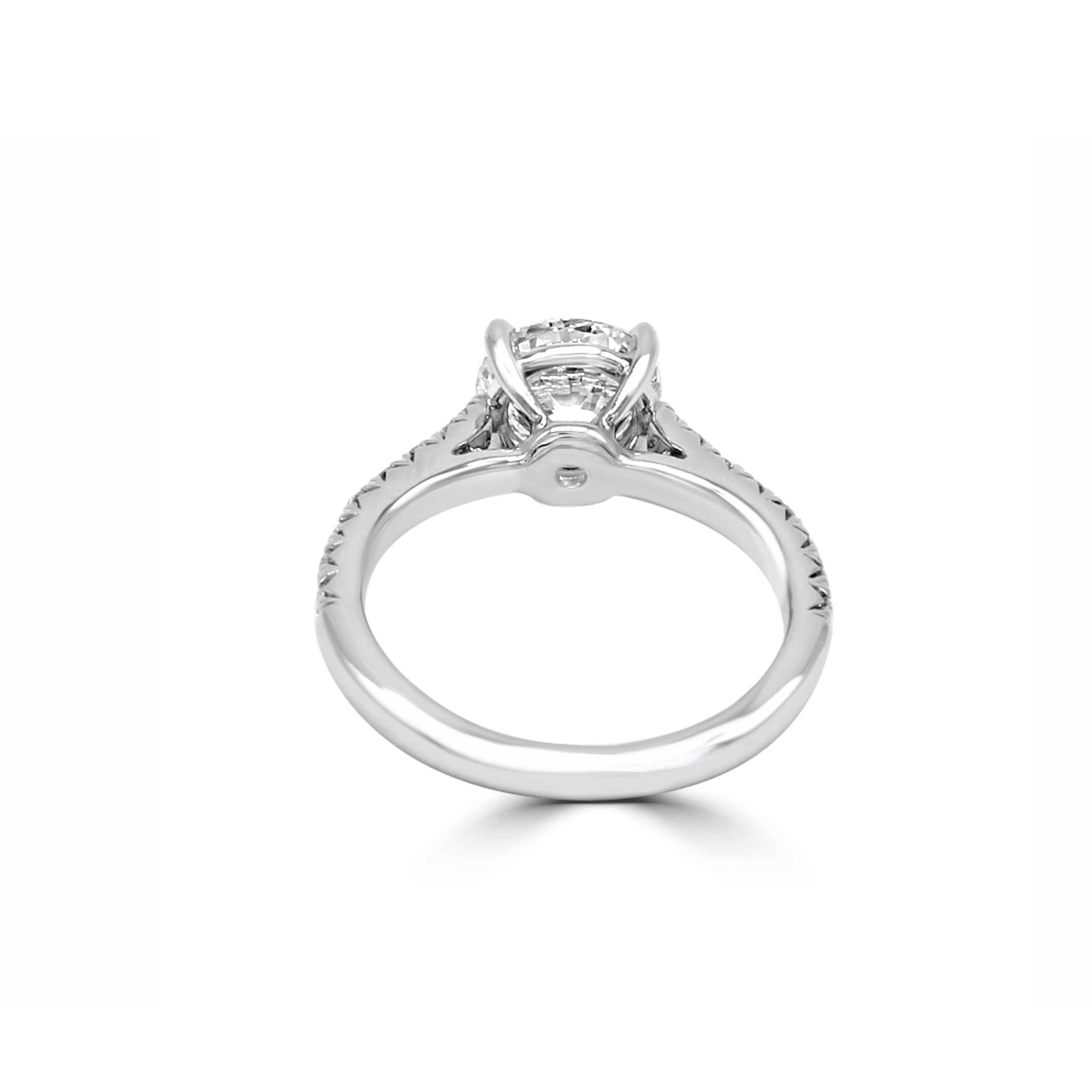 Low-profile ring with French-cut side stones and a center diamond.