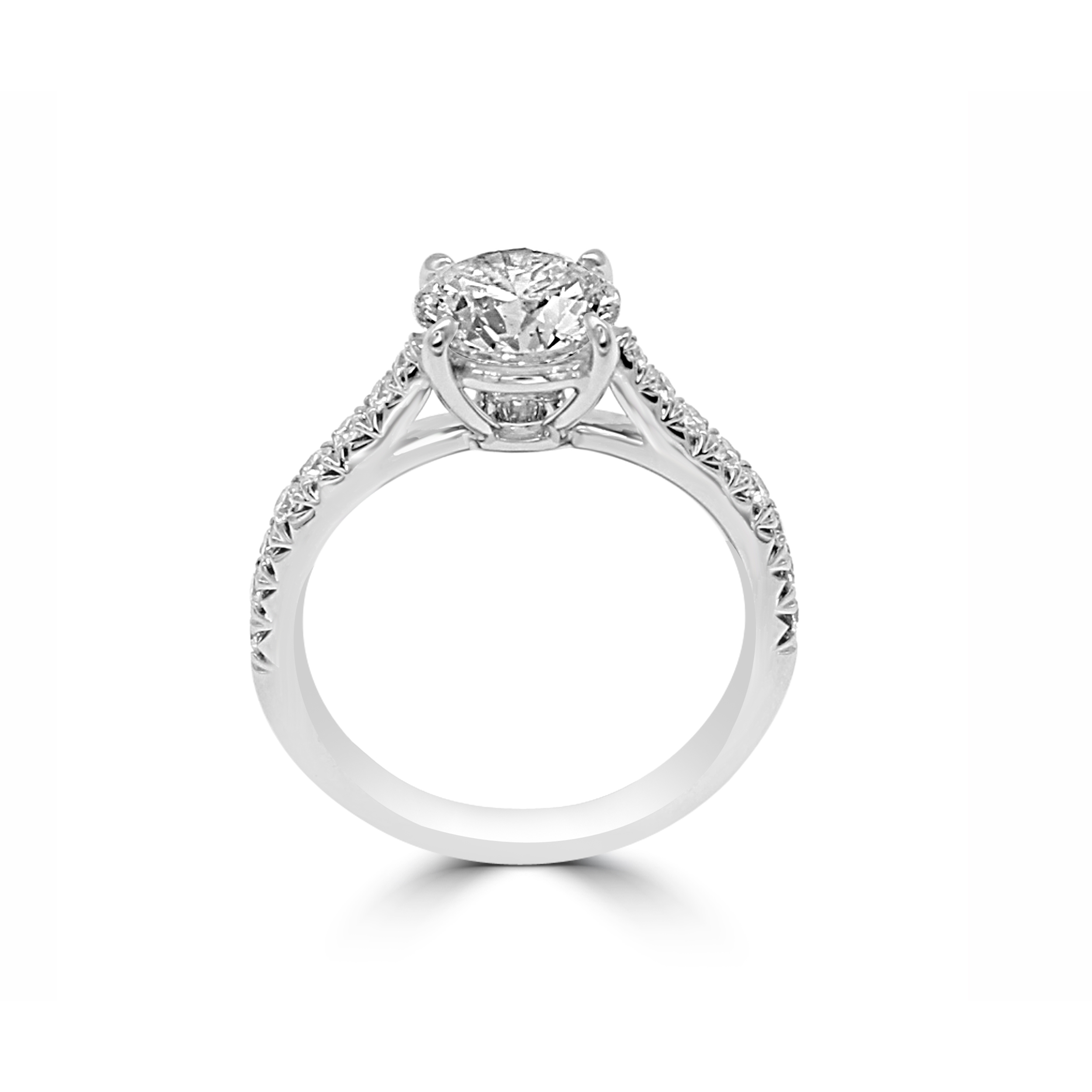 Low-profile ring with French-cut side stones and a center diamond.