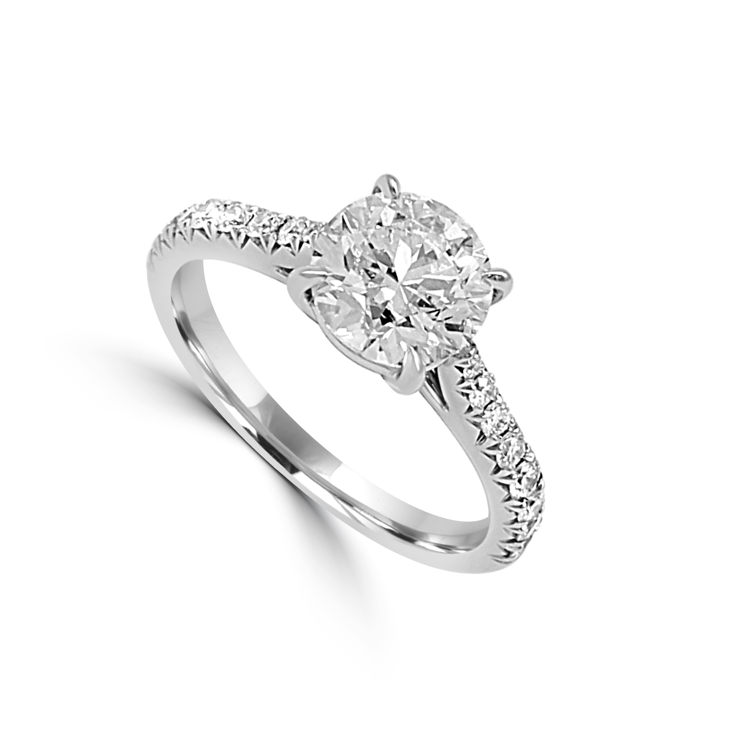 Low-profile ring with French-cut side stones and a center diamond.