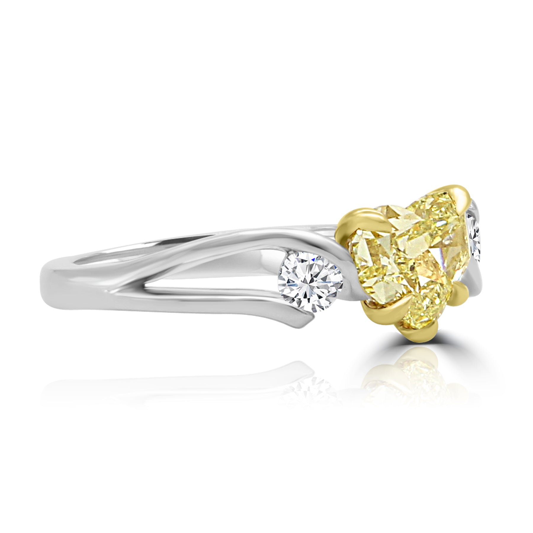 rare canary yellow heart-shaped diamond ring, with two round diamonds on the sides