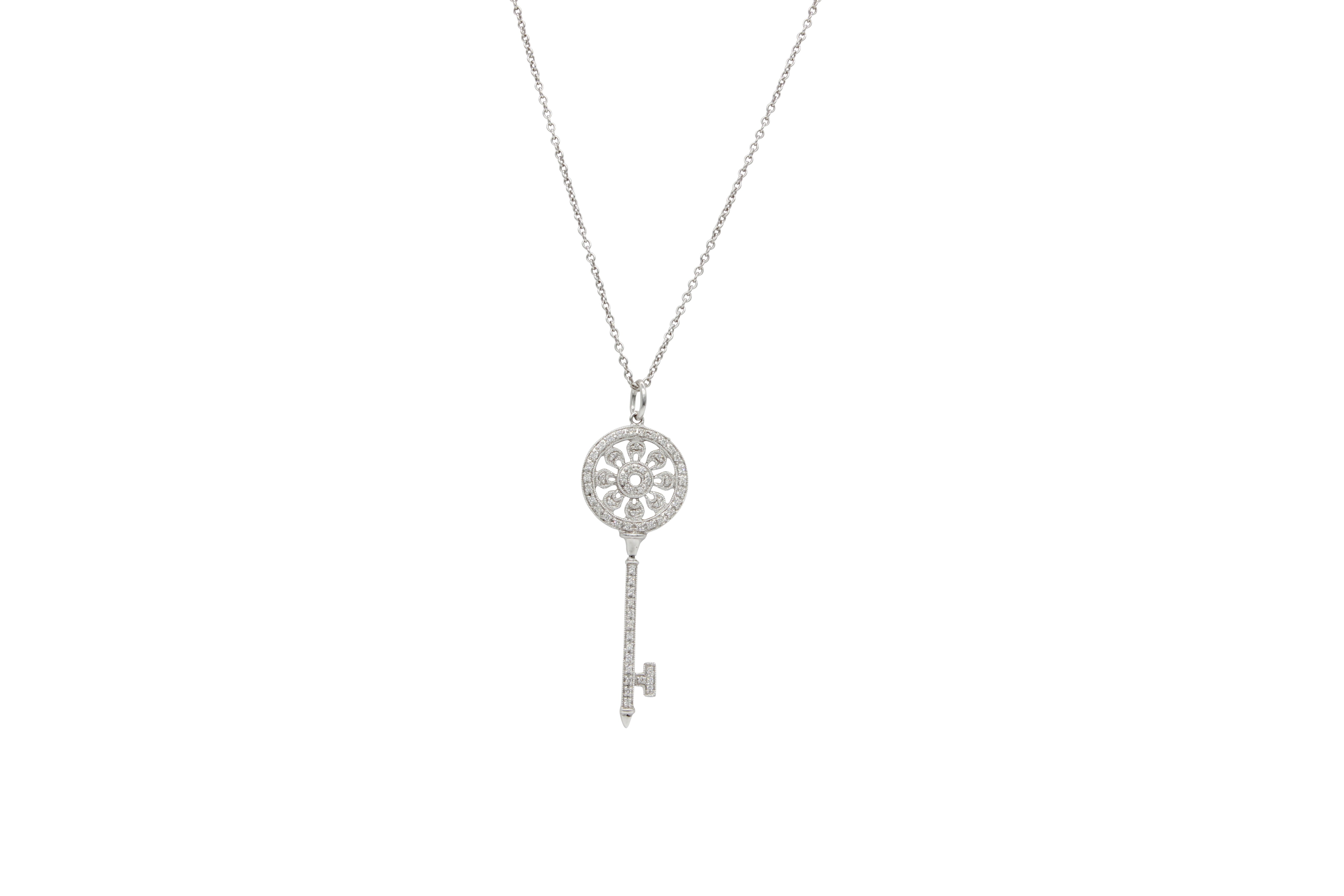 Key pendant with tiny sparkling diamonds