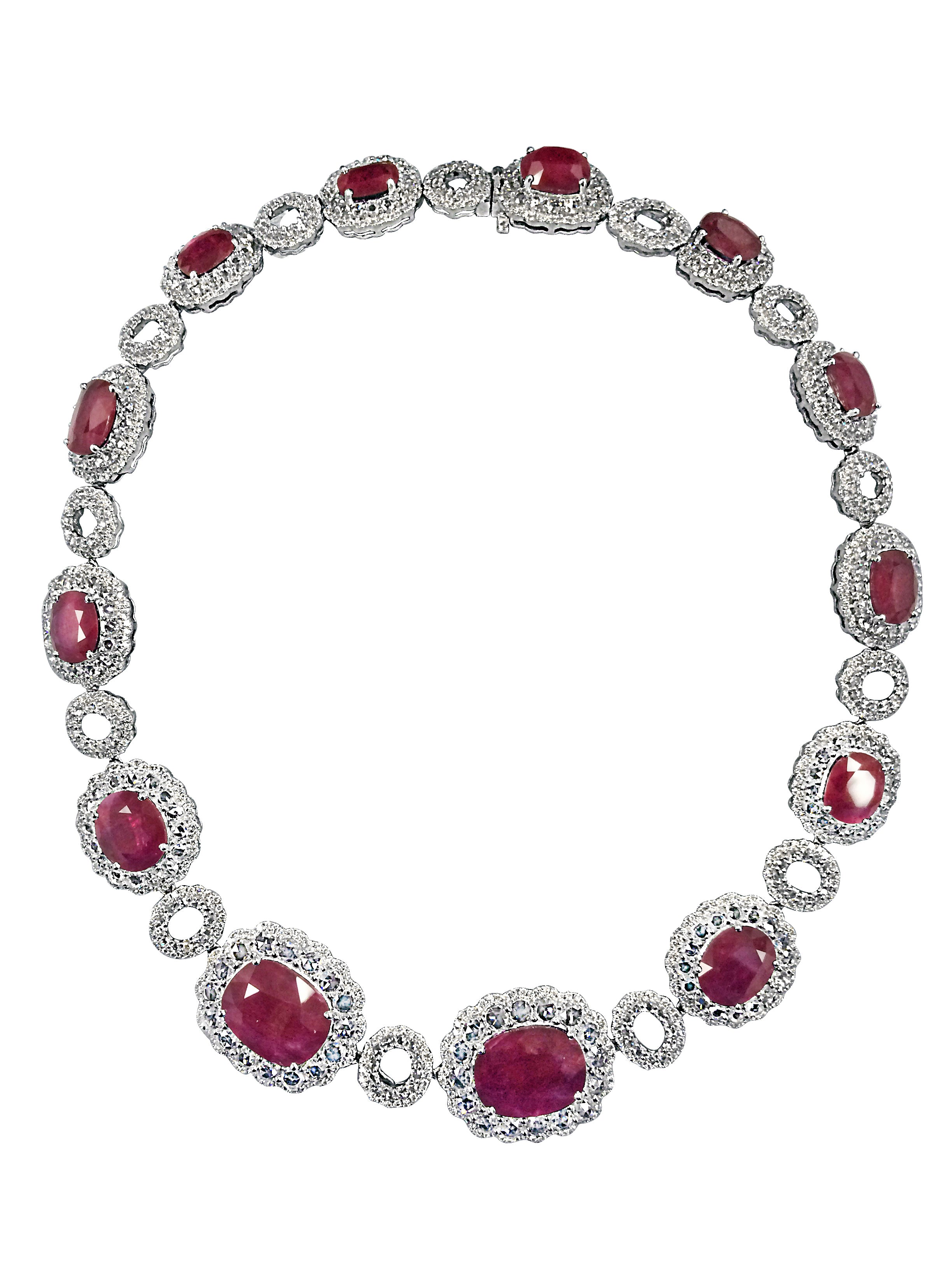 Natural Ruby center stones surrounded by Rose-cut diamonds.