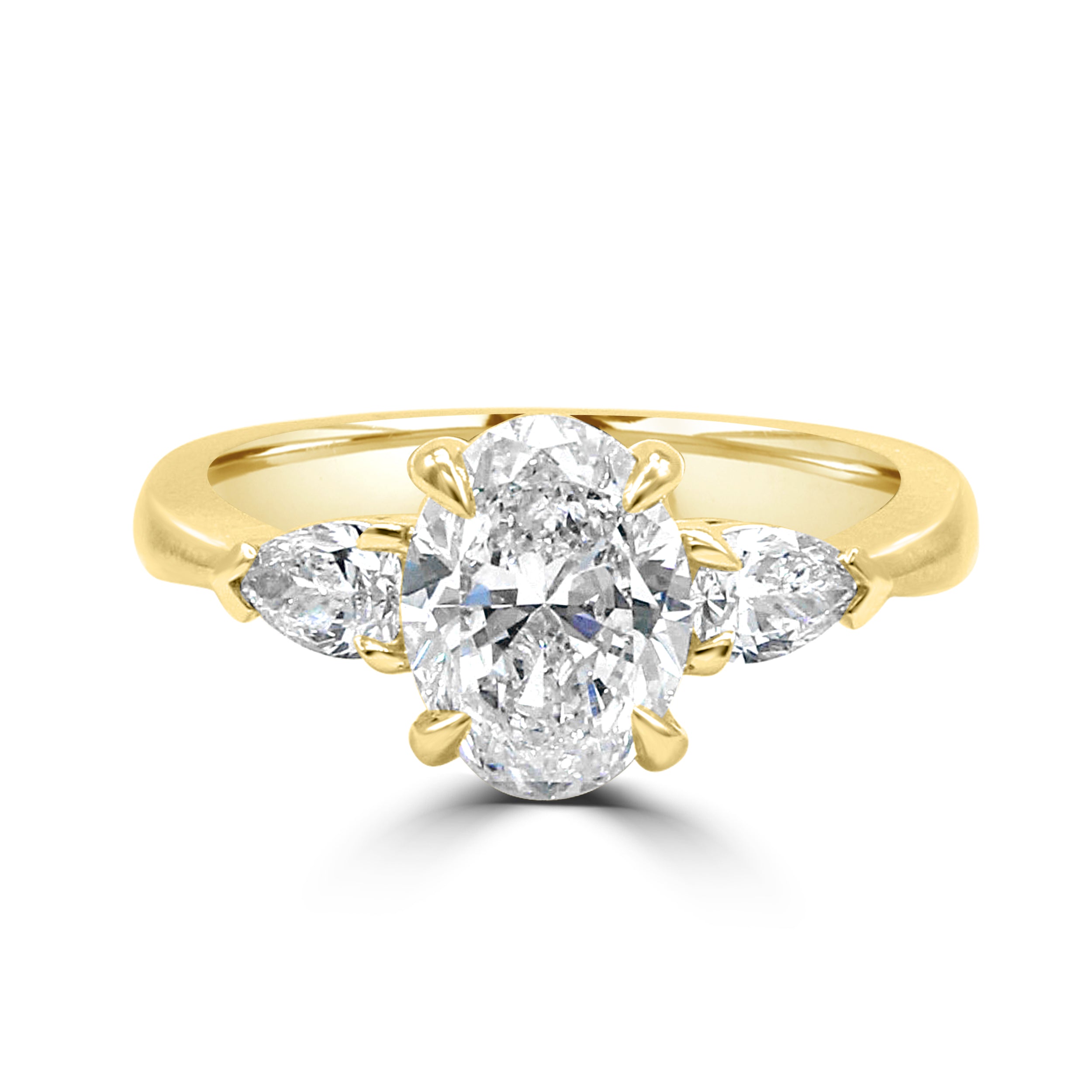 oval diamond with two pear side stone diamond ring