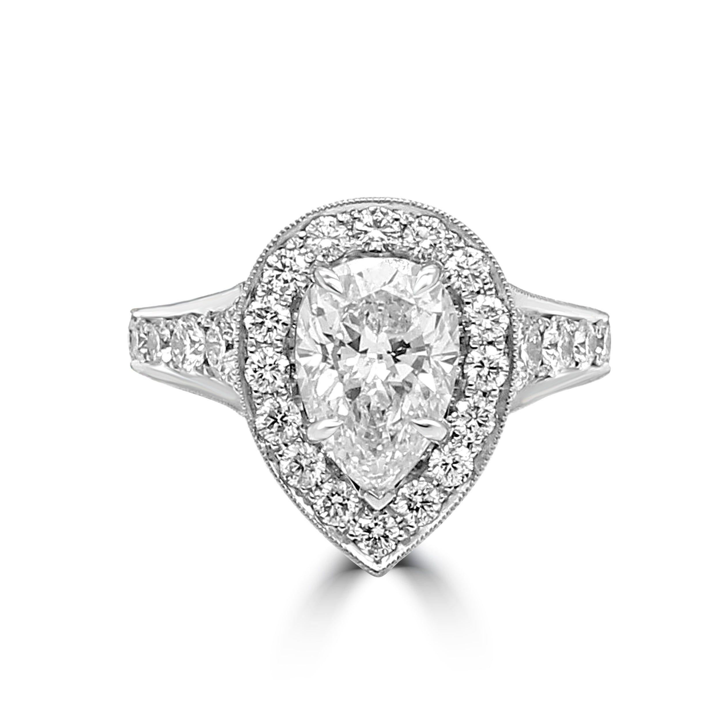pear shaped diamond ring with halo and diamond shank