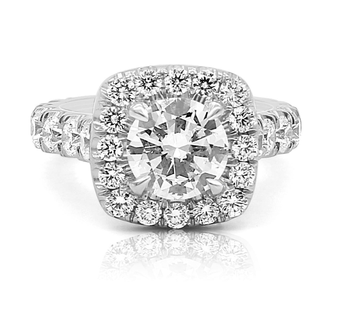 round diamond ring with a wide shank and large halo diamonds