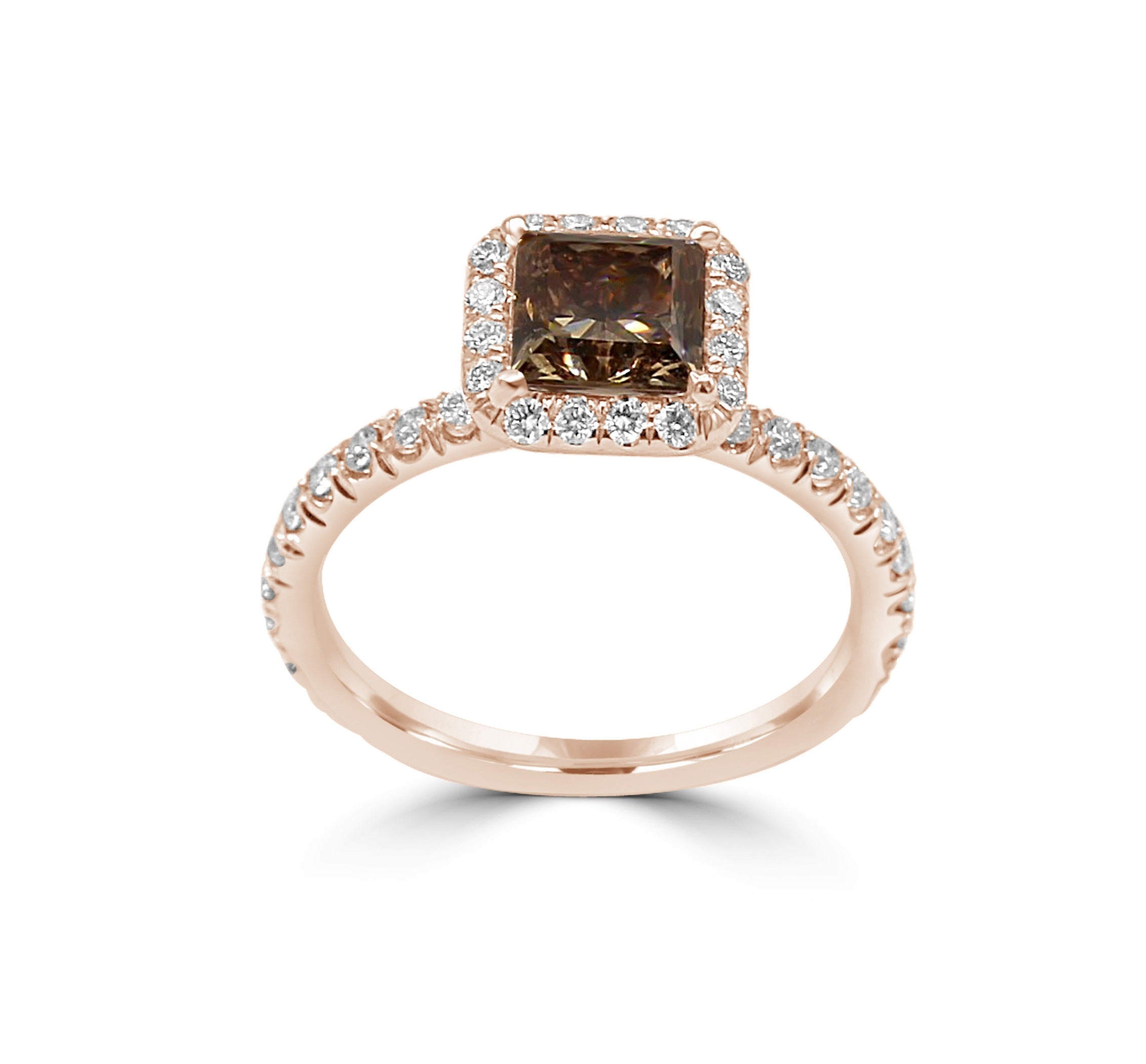  rose gold engagement ring with a fancy orangy-brown princess-cut diamond, surrounded by a sparkling diamond halo.






